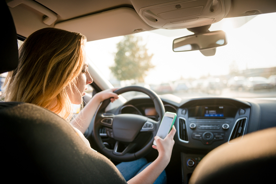 bigstock-Using-phone-while-driving-117298256.jpg