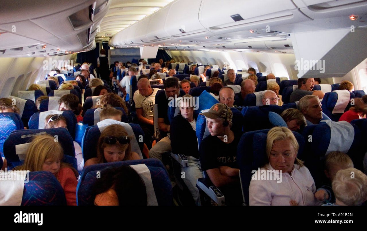 crowded-cabin-in-a-charter-flight-A91B2N.jpg