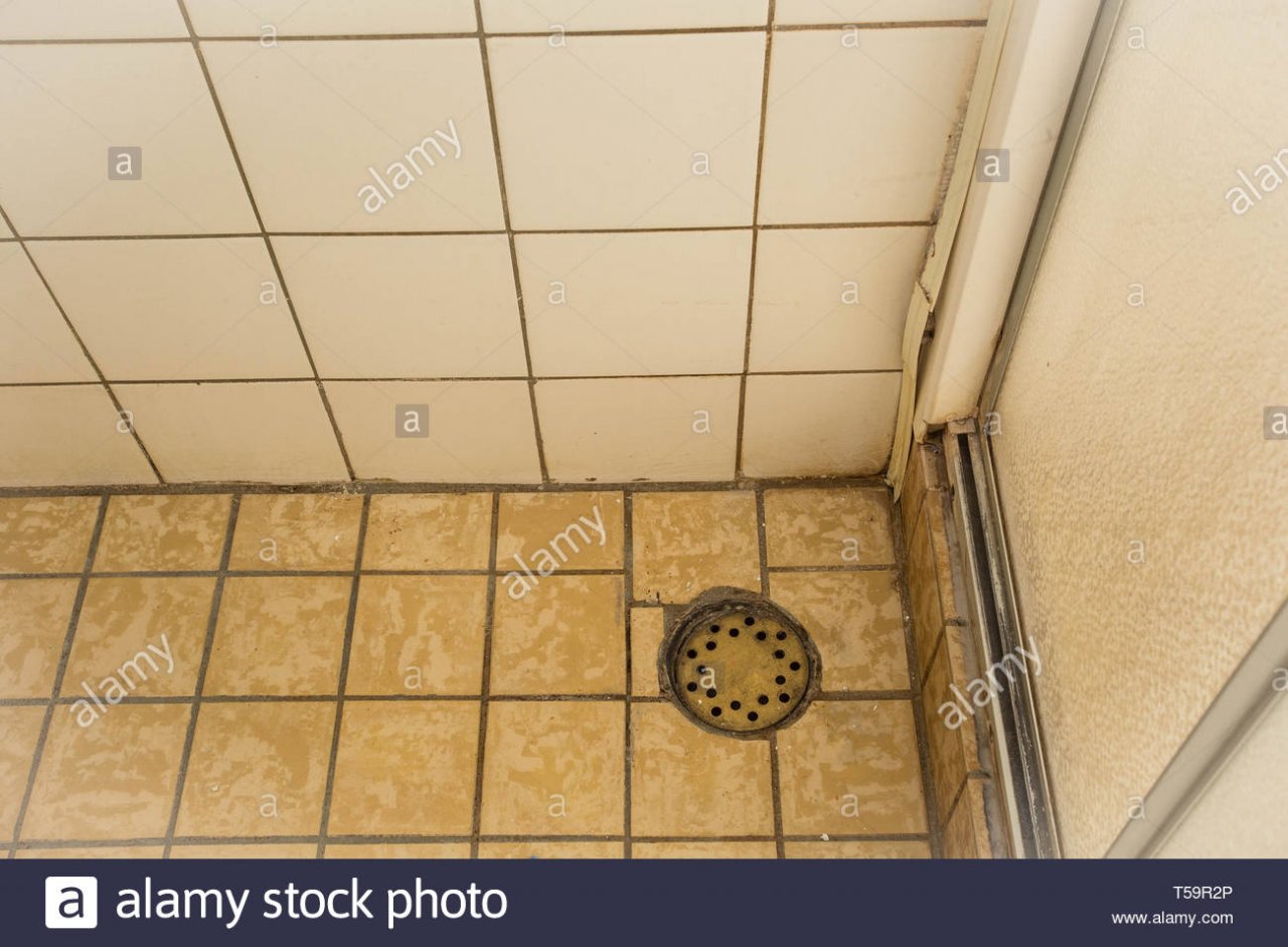 old-shower-drain-close-up-old-and-dirty-T59R2P.jpg