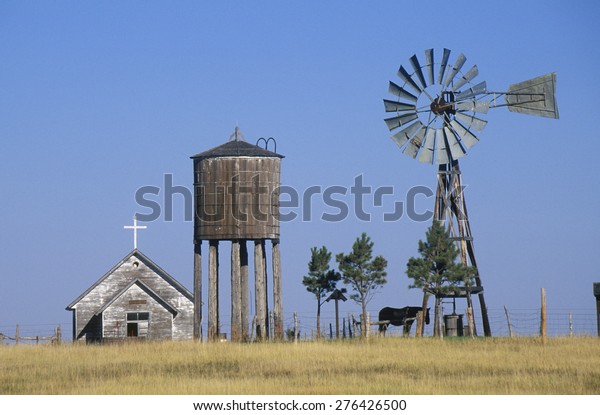 windmill-abandoned-prairie-church-wy-600w-276426500.jpg