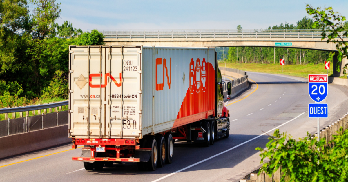 Semi truck with Canadian National Railway Logo on highway.