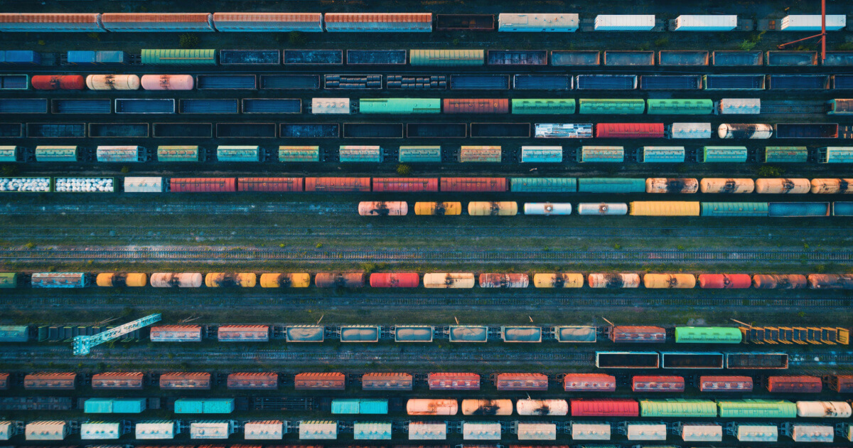 An ariel view of cargo freight in a rail yard.