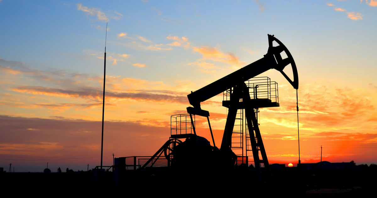 oil derrick at sunset in a desert