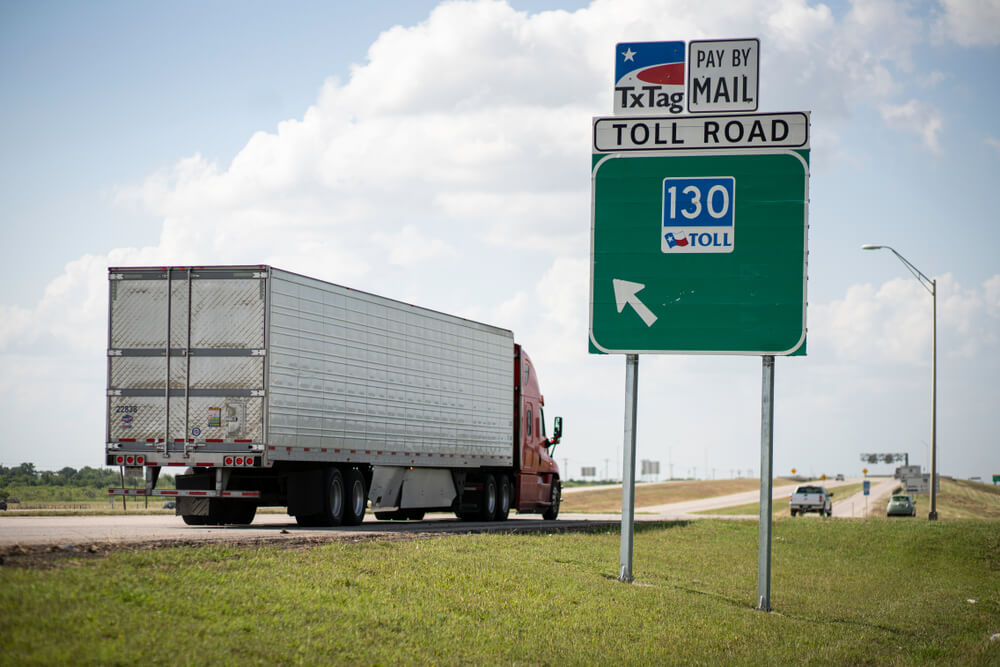 Semi Truck Driving on to a toll road