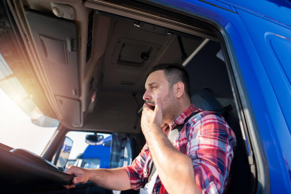 Truck driver yawning