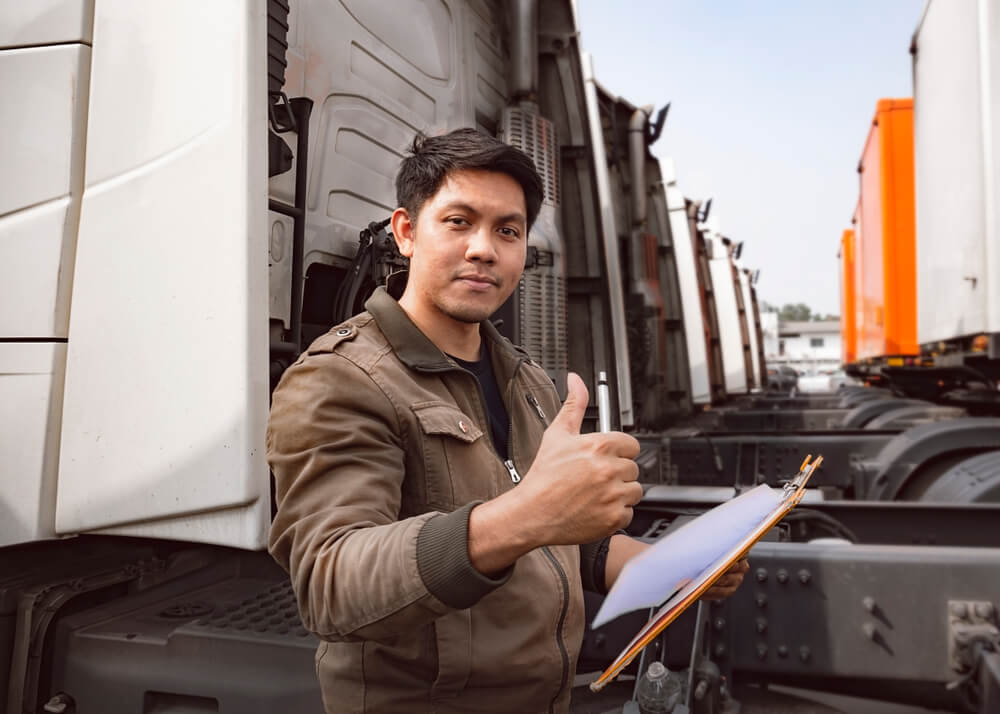 Truck driver doing safety inspection