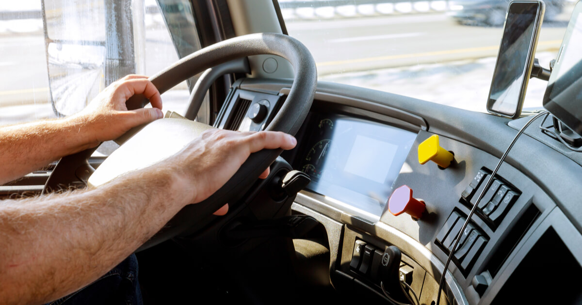 truck driver steering a semi